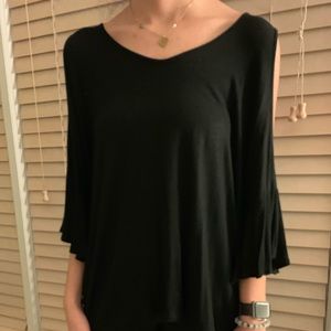 Black top with open arm